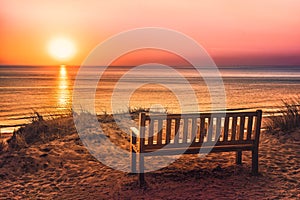 Empty bench near the beach at sunset on the island of Sylt