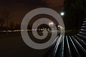 Empty bench at night in the park