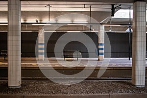 An empty bench on one of the platforms of Station Rijswijk The Netherlands