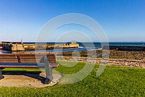 Empty bench overlooking St Monans harbor