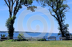 Empty bench on river coast