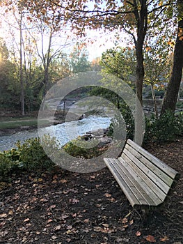 An empty bench by the river to sit in peace