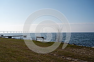 An empty bench by the sea during quarantine time in Sweden