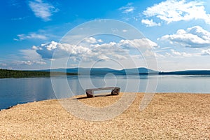 Empty bench on shore. Place for meditation.