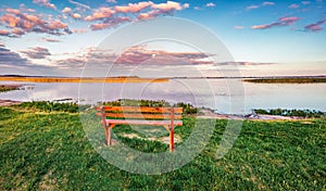 Empty bench on the shore of Svityaz lake, Shatsky National Park, Volyn region, Ukraine.