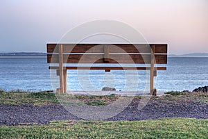 An empty bench at sunrise