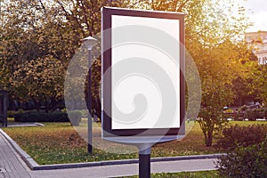 Empty billboard, advertising placeholder in a Moscow autumn park, mockup of a blank white poster.