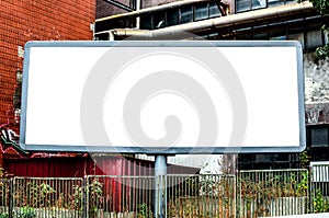 Empty billboard against urban background