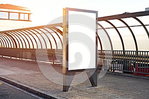 Empty billboard placeholder template on the city bus stop, mockup of a blank white advertising urban billboard.