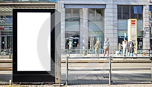 Empty billboard for public advertisement at the bus stop. Space for text. People and city background