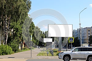 Empty billboard in an urban environment on a summer sunny day.