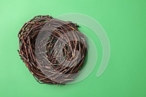 Empty bird nest isolated on green box background.