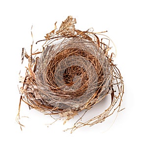 Empty bird nest isolated over a white background