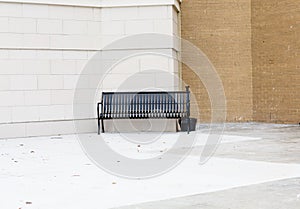 Empty Black Bench Outside Building for Smokers