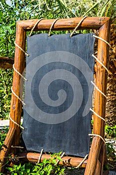 Empty black board, menu board at a restaurant