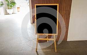 Empty black board at restaurant .