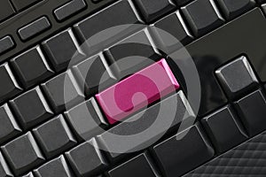 Empty black button and pink Keypad enter of computer keyboard.