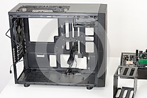 Empty black computer case, midi tower for micro ATX motherboard