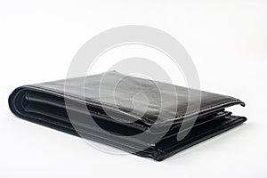 Empty black leather wallet on a white background