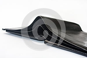 Empty black leather wallet on a white background