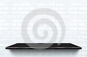 Empty black marble shelf at white ceramic tile wall pattern back