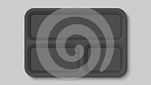 Empty black plastic food container with three compartments.