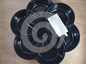 Empty black plastic food container