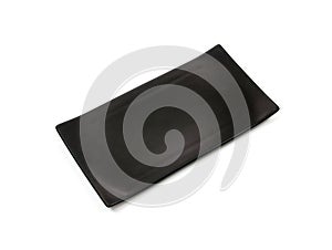 Empty black rectangle ceramic plate with rough texture, isolated on white background with clipping path, Top view