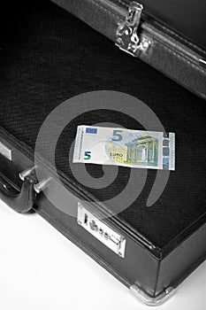 Empty black suitcase with little money.