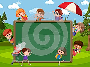 Empty blackboard with many children at the park scene