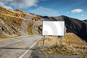 Empty blank billboard mockup, near asphalting road in mountains of Transfagarasan