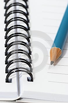 Empty blank ring, spiral notepad, blue pencil