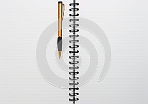 Empty blank ring, spiral notepad, one gold pen