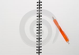 Empty blank ring, spiral notepad, one orange pen