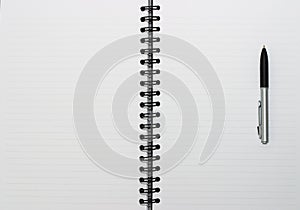 Empty blank ring, spiral notepad, one pen