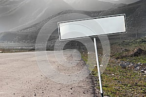 Empty blank road sign concept. The path extending into a gloomy distance