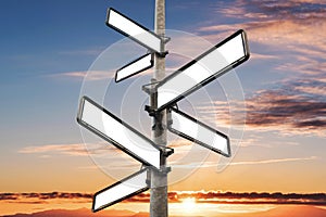 Empty blank road signpost, with sunset sky background