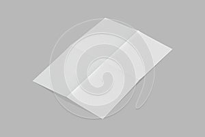 Empty blank white folded paper Mock up isolated on a grey background.