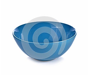 Empty blue ceramic bowl isolated white background.