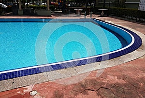 Empty Blue Mosaic swimming pool with ripples