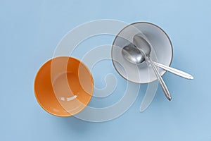 Empty blue and orange breakfast or dessert bowls