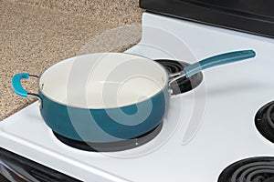 Empty Blue Pan Sitting On Stove Top With Copy Space