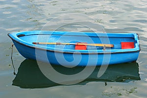 Empty Blue Rowing Boat