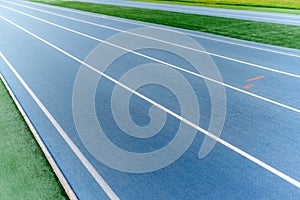 Empty blue running track, without people