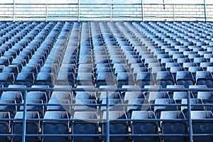 Empty blue stadium seats pattern with clean and orderly.