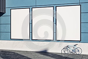 Empty blue wall with frames