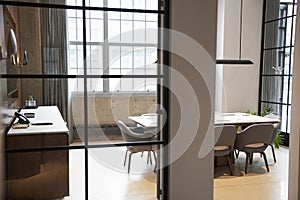 Empty boardroom at a business seen through open door