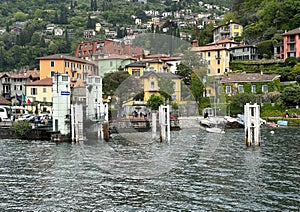 Empty boat dock at Varenna on Lake Como photographed from an approaching ferry of the Navigazione Laghi