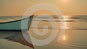 Empty boat on sandy beach in bright day. Large old white boat on sandy seaside ready to sail in bright day on beach