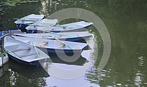 Empty boats moored to the shore